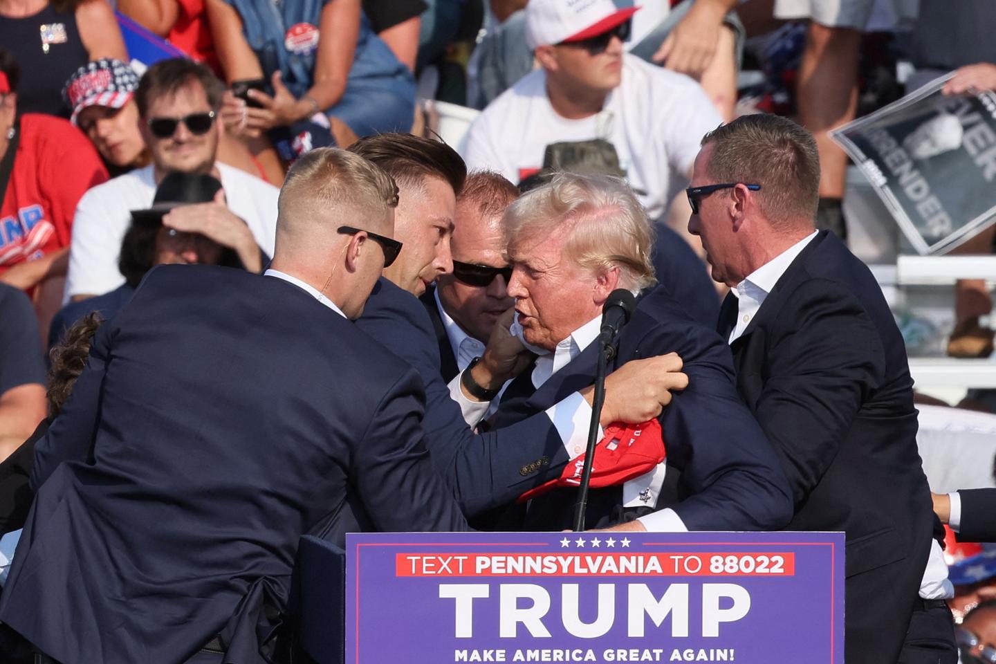 Trump whisked off stage in Pennsylvania after apparent gunshots rang through crowd