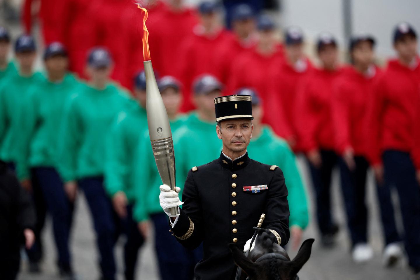 Olympic torch arrives in Paris amid Bastille Day celebrations
