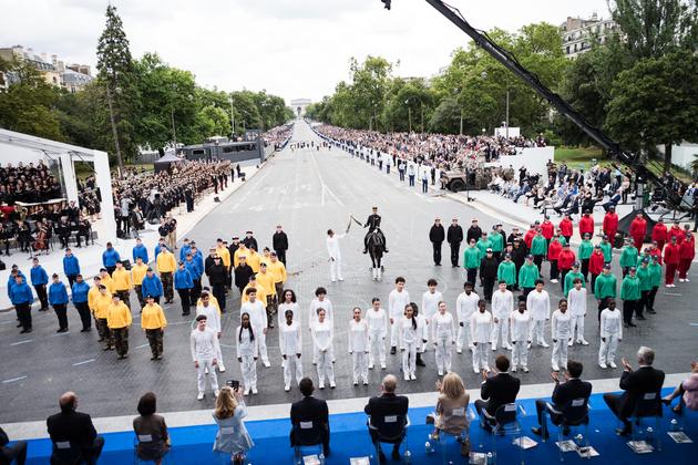 The Olympic flame passed to the torchbearers who will carry it to City Hall, Paris, on July 14, 2024.
