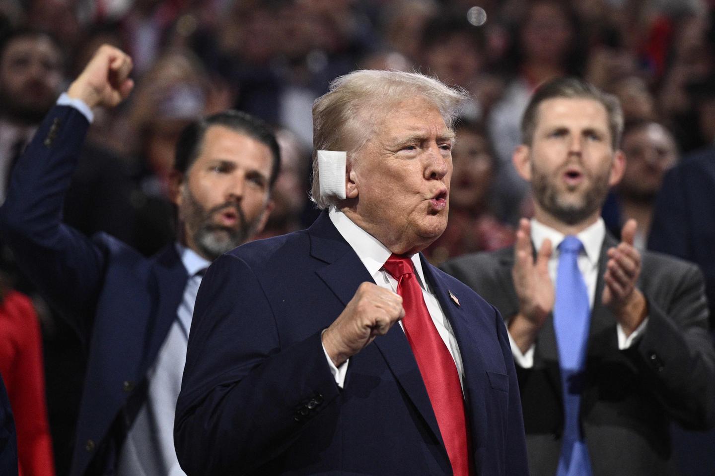 Trump enters Republican convention hall in Milwaukee with a bandaged ear and gets a hero's welcome