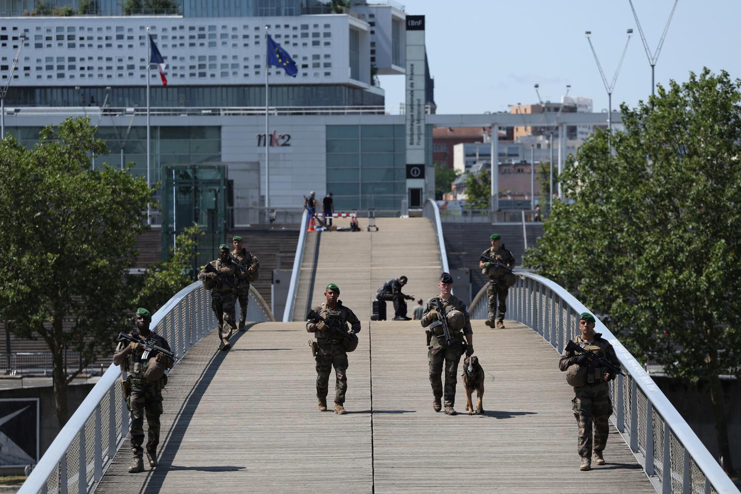 Central Paris locks down for Olympics as athletes arrive
