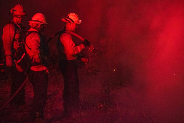 On Thursday, police arrested a 42-year-old man suspected of starting the fire by sending a burning car into a ravine.