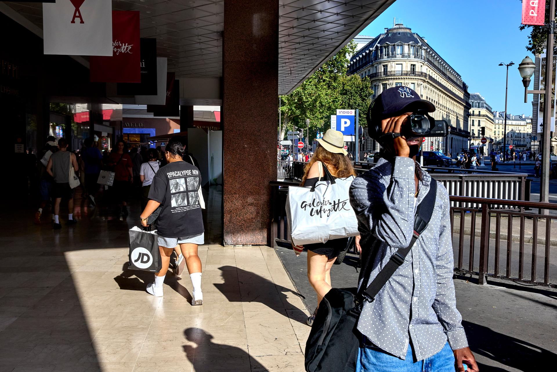 Customers and tourists crowd around Printemps and Galeries Lafayette, Paris, July 29, 2024.