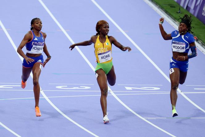 France's Gémima Joseph, Côte d'Ivoire's Maboundou Koné and Adaejah Hodge of the British Virgin Islands during their Paris 2024 Olympic Games 200m semi-final at the Stade de France, in the northern Paris suburb of Saint-Denis, on August 5, 2024.