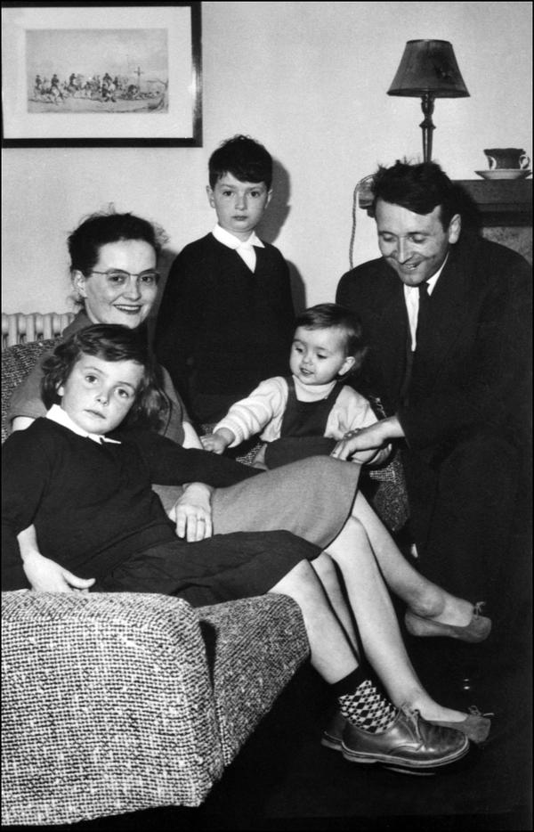 Edouard Leclerc at his home in Landerneau, France, with his wife Hélène and their three children, Michel (now Michel-Edouard), standing; Hélène, on the sofa; and Isabelle, on November 7, 1959.