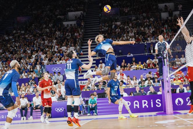 France's Barthélémy Chinenyeze (center, about to smash), during the final of the Olympic volleyball tournament against Poland, at the Arena Paris Sud, in Paris, on August 10, 2024.