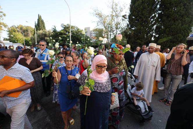 A rally in Nice following the death of seven people in an arson attack on the Moulins district, which had been the target of a 