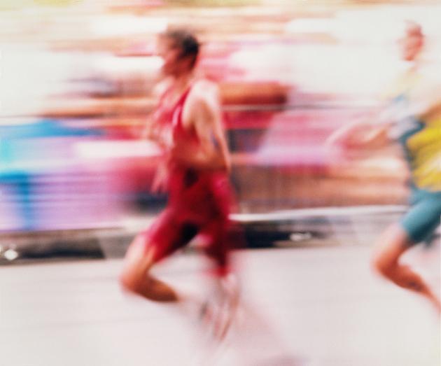 Triathletes at the running event on the Avenue des Champs-Elysées, Paris, on July 31.