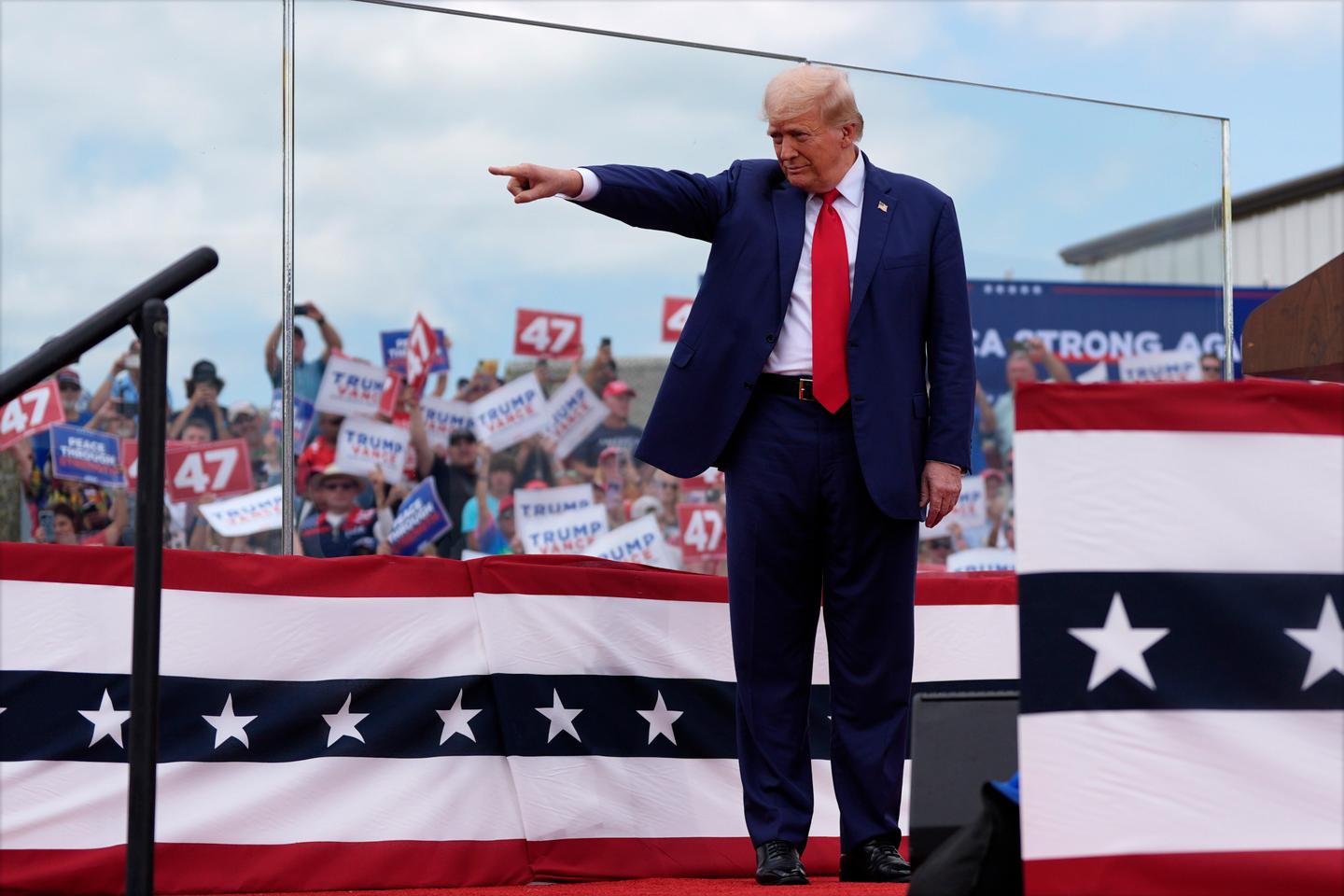 Trump holds first outdoor rally since assassination attempt, speaks behind bulletproof glass