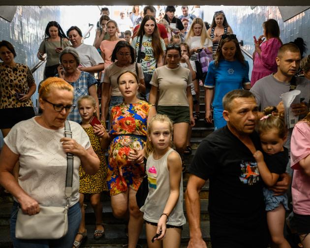 Barabashovo market shoppers descend into the metro to protect themselves from Russian shelling, Kharkiv, Ukraine, September 1, 2024.