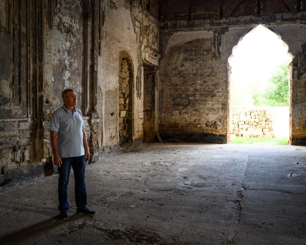 Viktor Mykhalchenko, an amateur historian who has written a biography about the Couriss family, at Kurisove Castle, Ukraine, September 11, 2024.