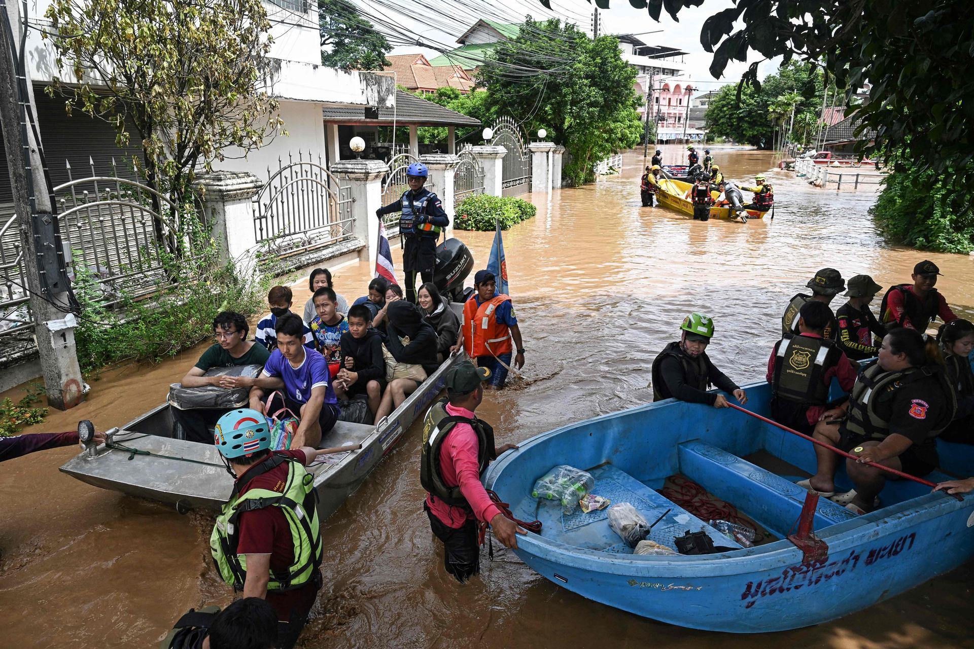 Local rescue teams recover schoolchildren and residents during flooding in the city of Chiang Rai (Thailand), September 12, 2024.