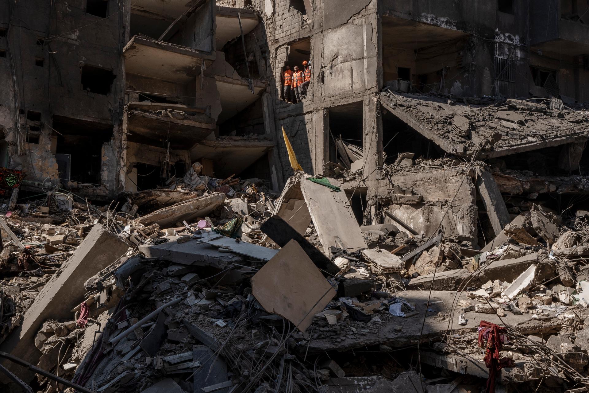 Rescue workers look over the scene of the Israeli strike that is believed to have caused Nasrallah's death on Friday, in Dahiyeh, Lebanon, on September 29, 2024.