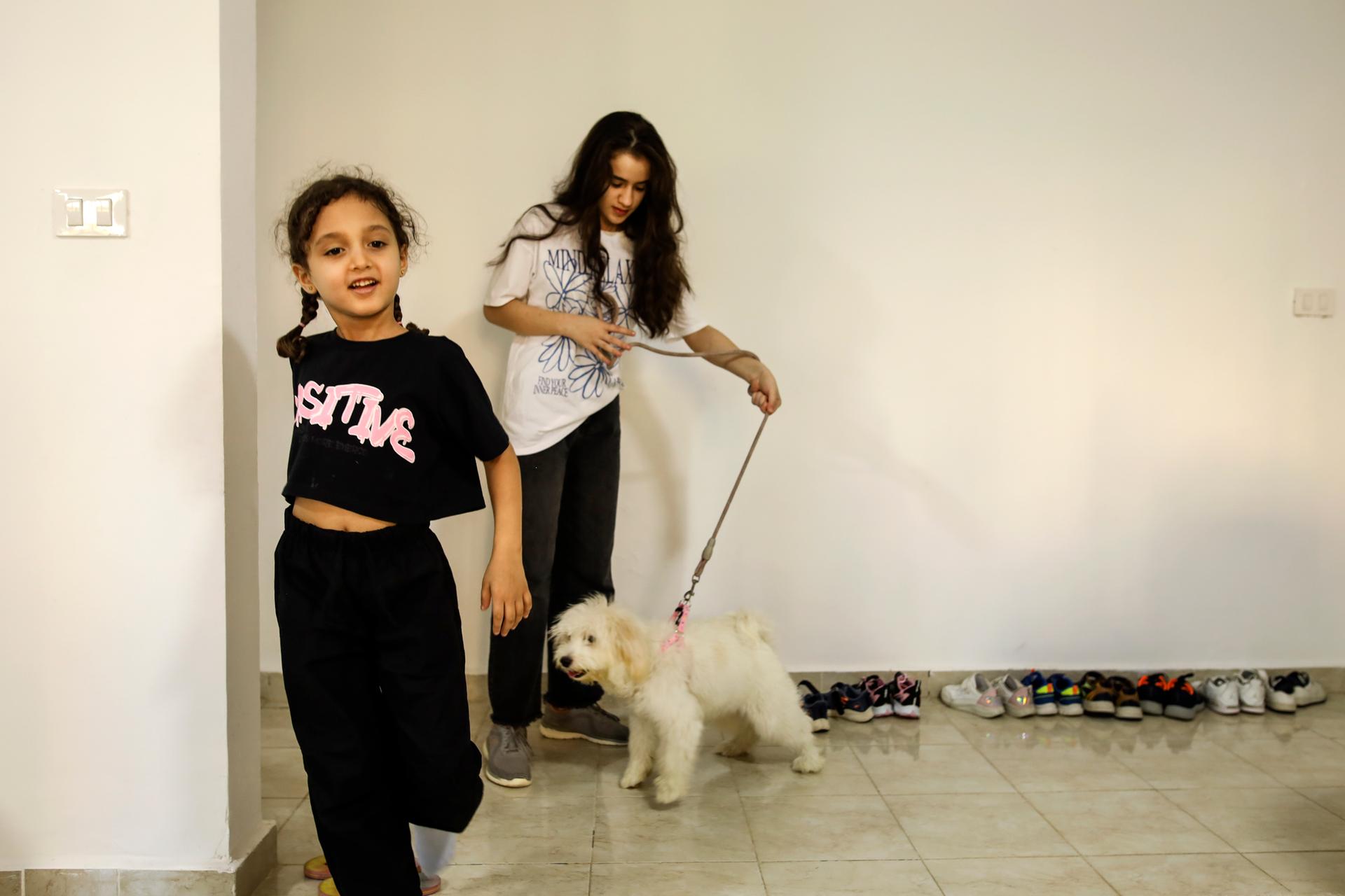 Hana Al-Tabaa's children in their Cairo apartment, September 29, 2024.