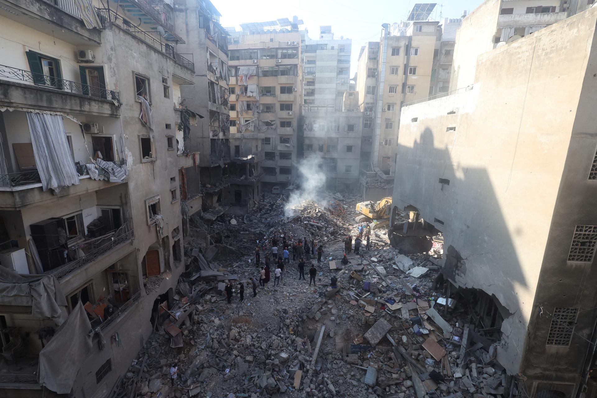 People inspect damage at the site of an Israeli strike, Beirut, Lebanon, October 11, 2024.