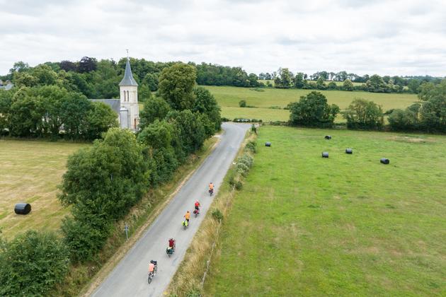 The Voie Verte de la Suisse Normande passes in front of the church in Cossesseville (Calvados).