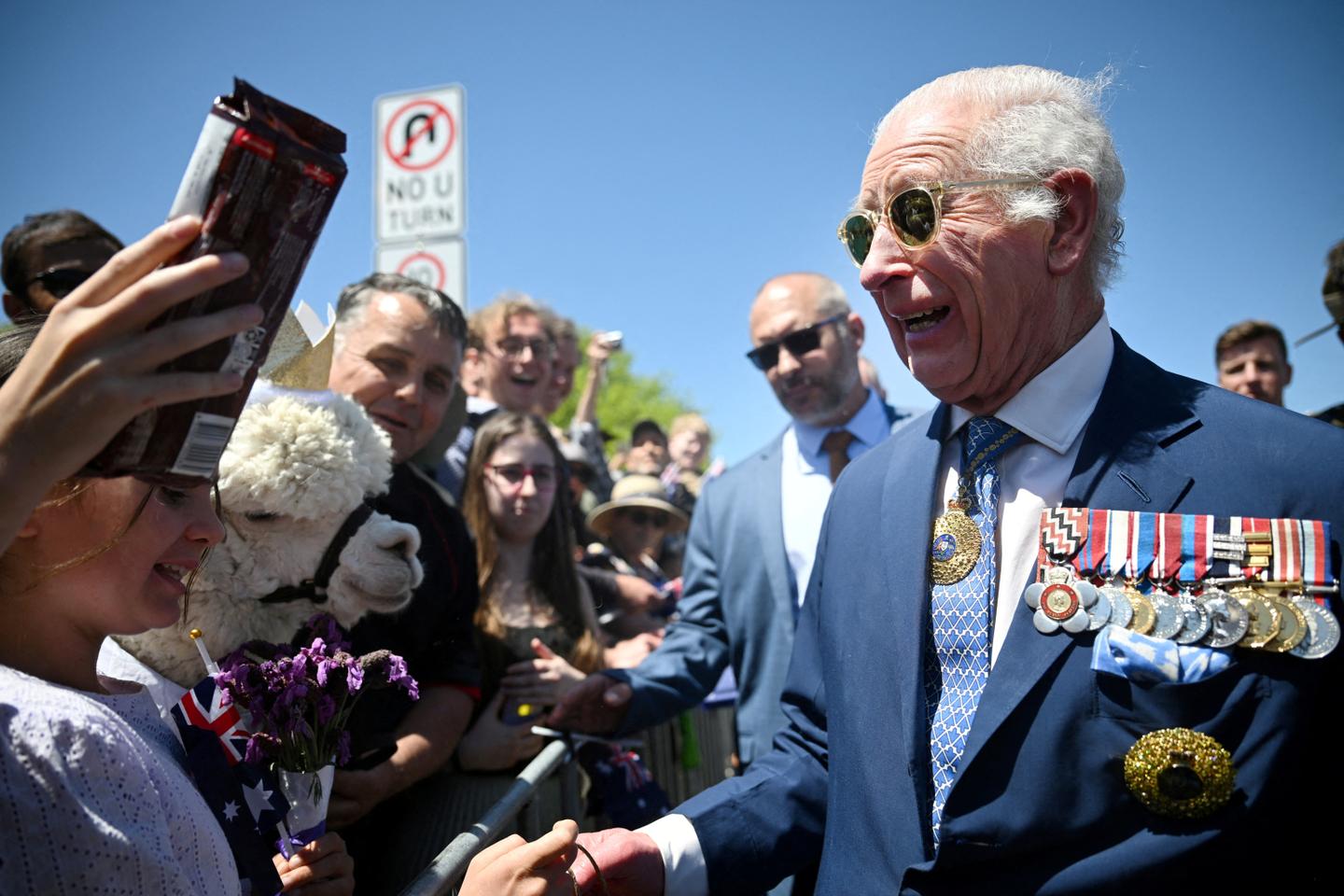 Sneezing alpacas, hecklers and climate warnings: King Charles' lively visit to Australia's capital