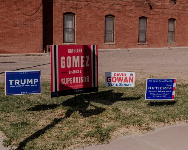 Campaign posters, including Kathleen Gomez's, in Douglas, Arizona, on October 5, 2024.