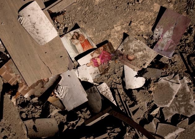 Family photographs in the rubble of a building hit the previous day by two Israeli strikes, killing six people including four children, in Baalbek, Lebanon, October 22, 2024.