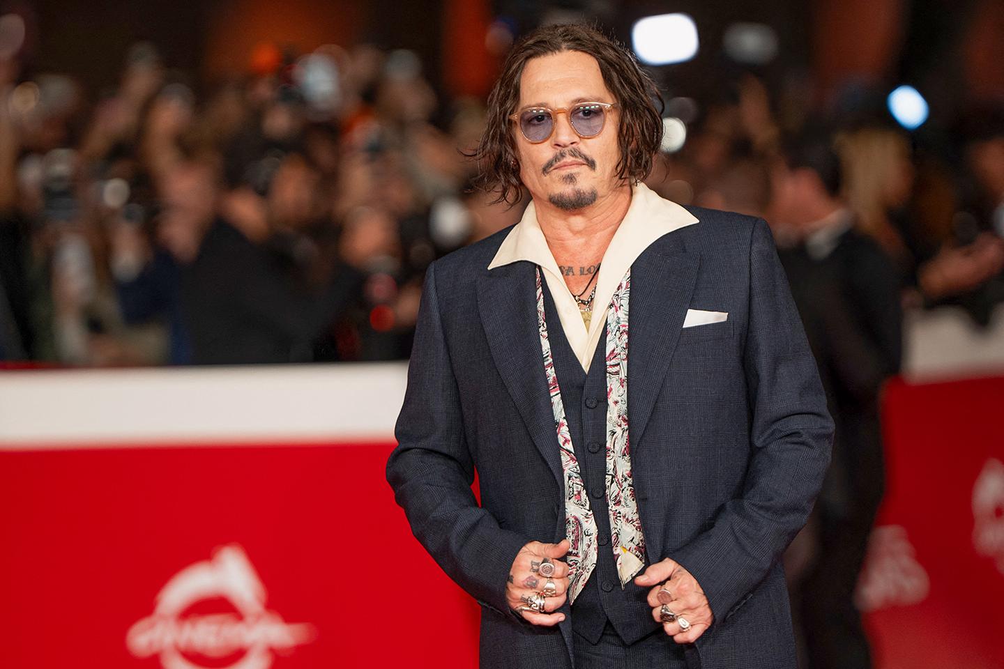 Johnny Depp on a red carpet in Rome. Does anyone care?