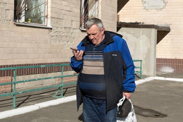 Petro, 62, in the lobby of the building in Kyiv where he is being housed by the Ukrainian government, Kyiv, October 20, 2024. He left the occupied city of Luhansk at the beginning of October 2024.