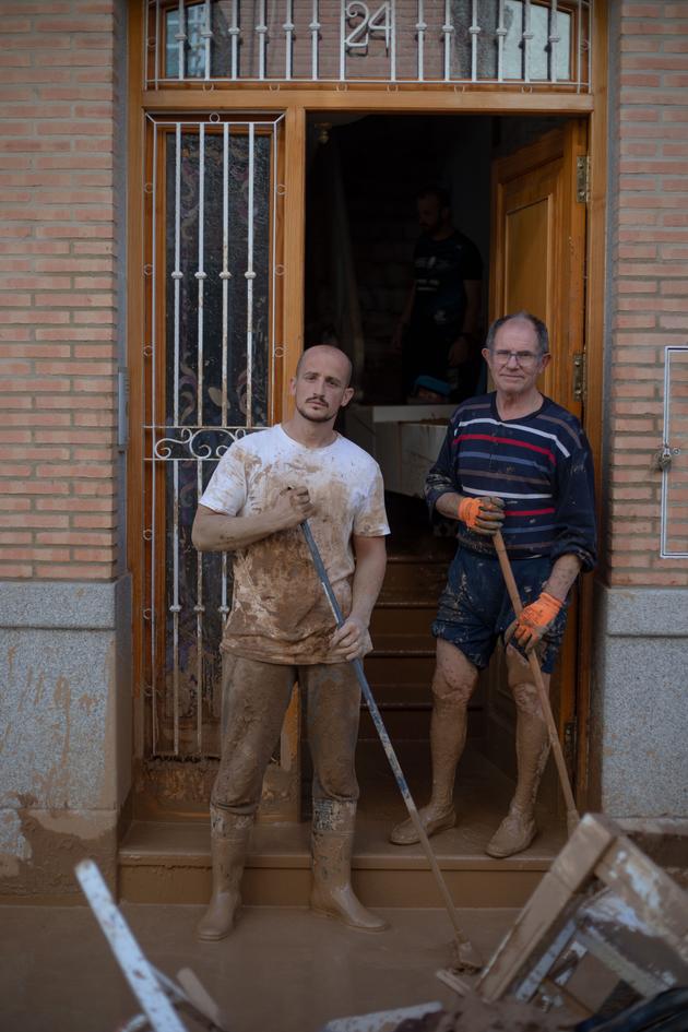 Vicente and José Luiz, in front of the latter's house in Paiporta, Spain, a southern suburb of Valencia, on October 31, 2024.