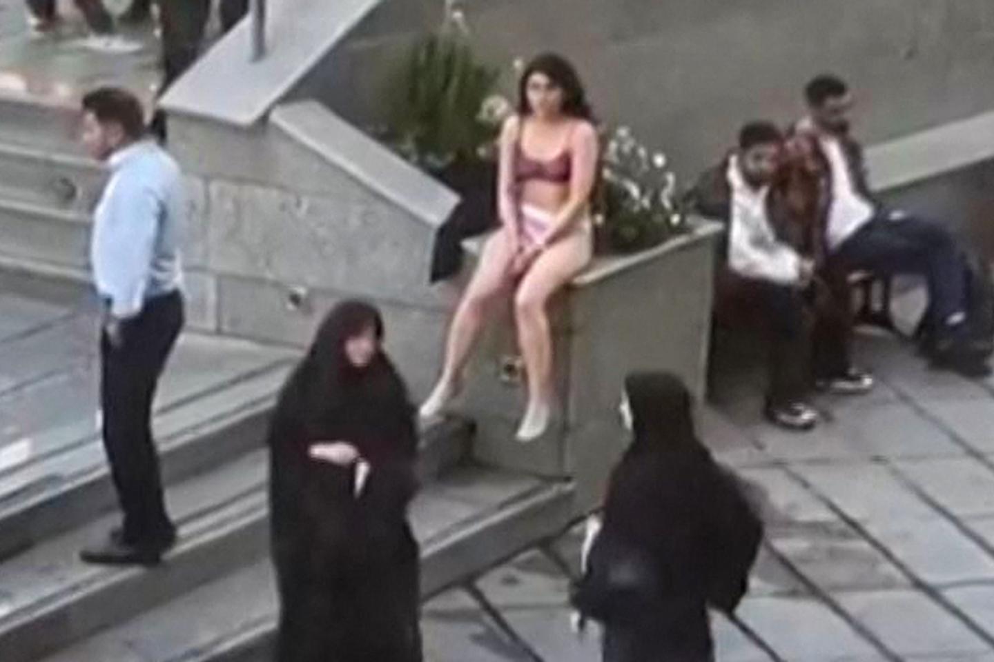 Iranian woman who stripped in protest moved to 'specialized care center,' says Iran embassy in Paris