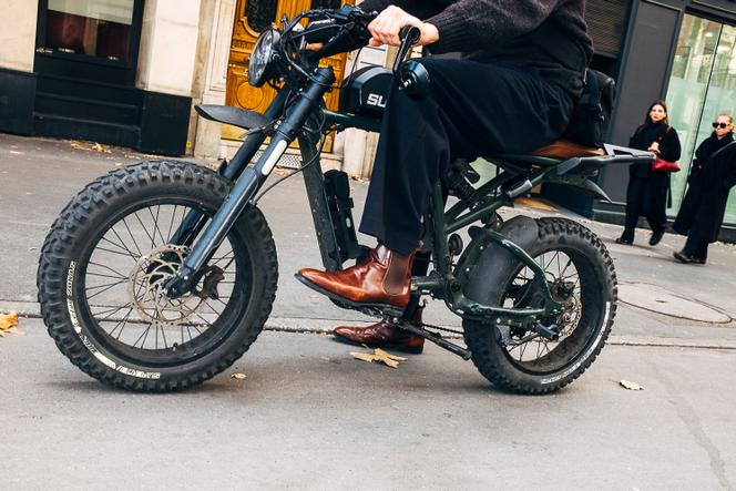 An electric fatbike rider, Place de la Bastille, Paris, October 22, 2024.