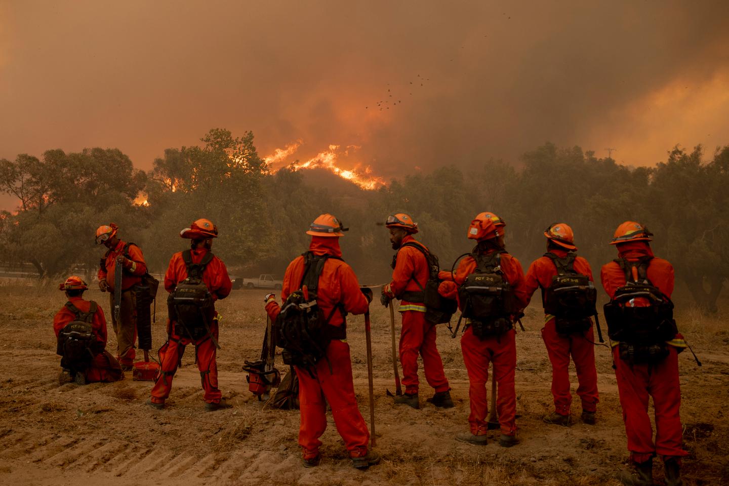 In California wildfire, firefighters could get a break when Santa Ana winds diminish