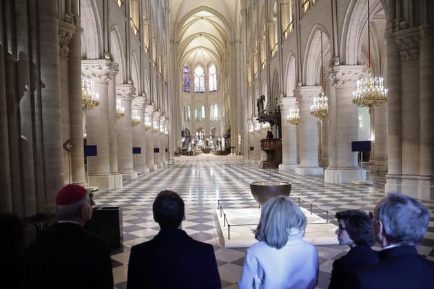 French President Emmanuel Macron (C-L), his wife Brigitte Macron (C) and Culture Minister Rachida Dati (C-R) visit Notre-Dame de Paris cathedral in Paris, on November 29, 2024.