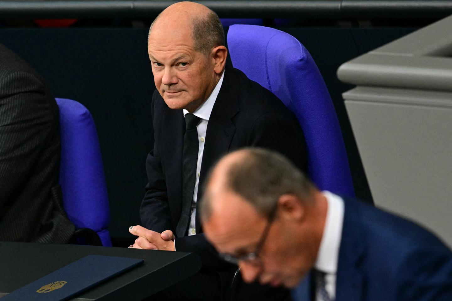 In Germany, Chancellor Olaf Scholz and his conservative rival Friedrich Merz clash over military aid to Ukraine