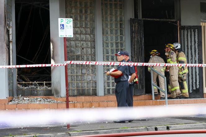 Fire crew members and police officers work the scene of a fire at Adass Israel Synagogue in the suburb of Ripponlea, Melbourne, Australia, on Friday, December 6, 2024.