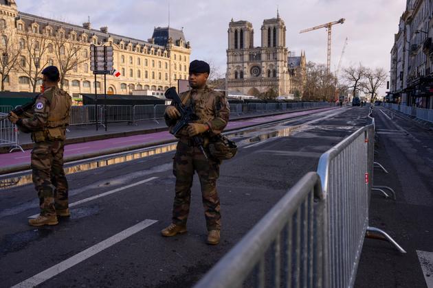Soldiers patrol in front of Notre-Dame on Saturday moring.