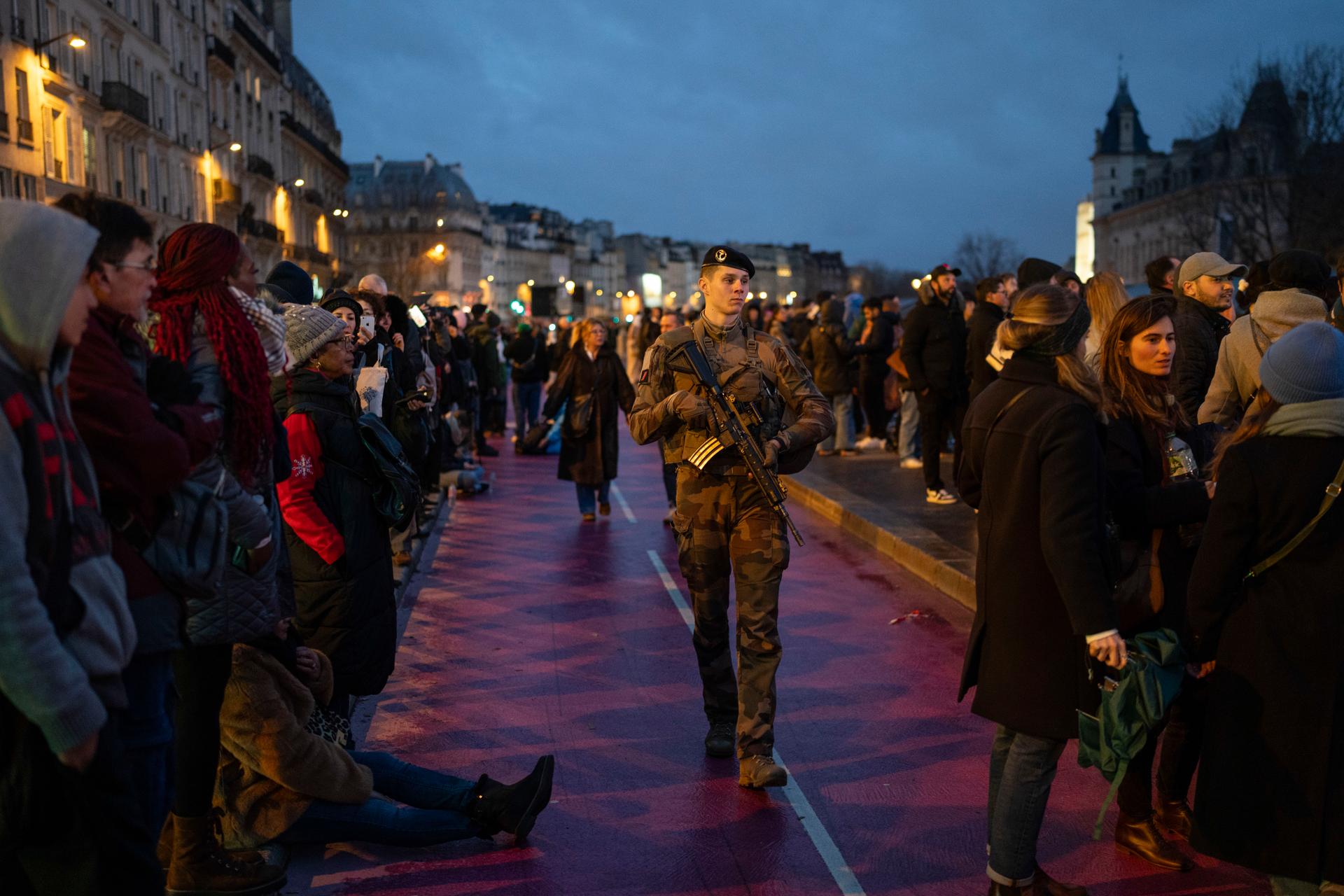 A French military soldier patrols near Notre-Dame.