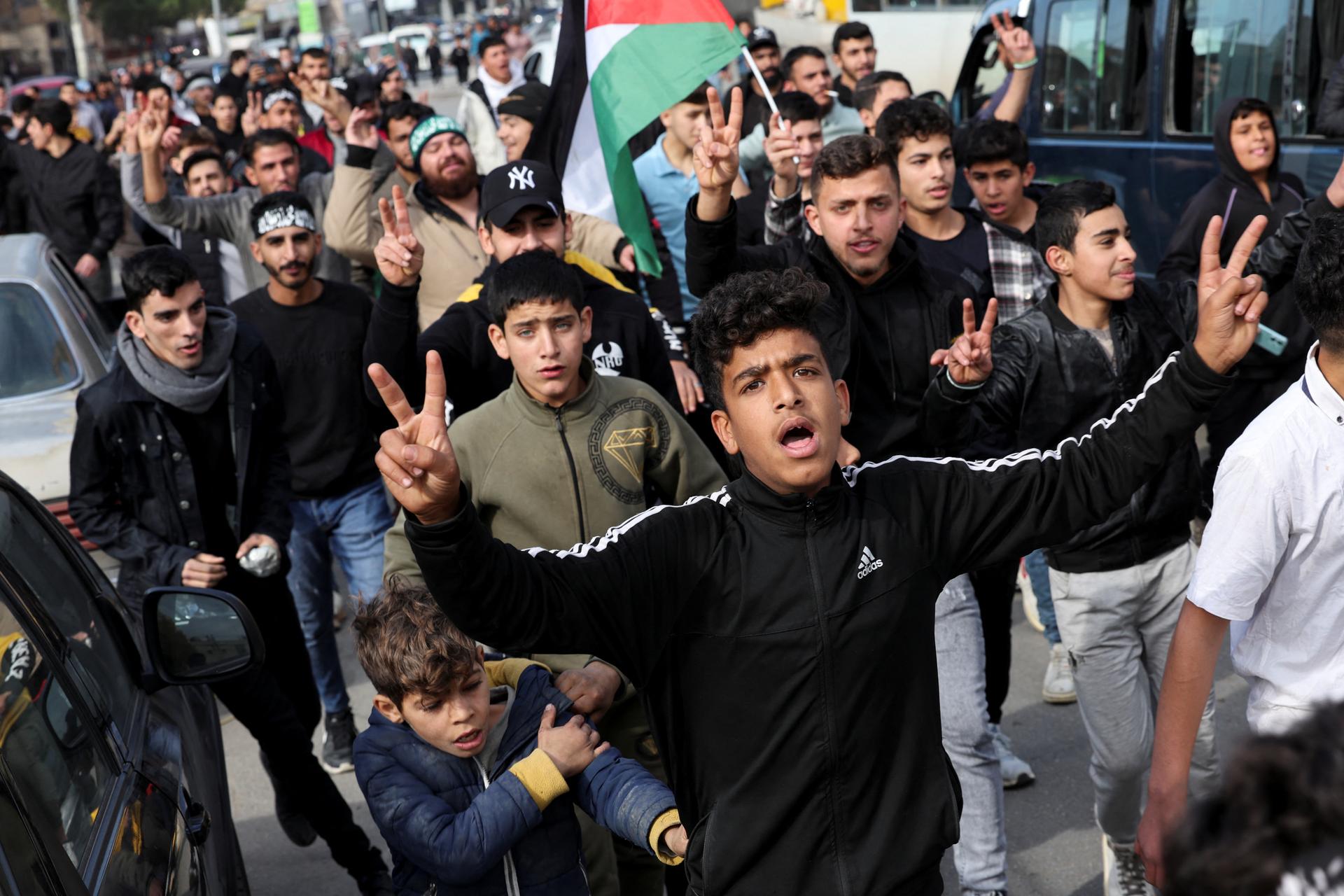 People walk at the Masnaa border crossing, in Lebanon, December 8, 2024.