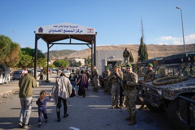 People cross into Syria at the Masnaa border crossing, in Lebanon's Bekaa Valley, on Sunday, December 8, 2024.