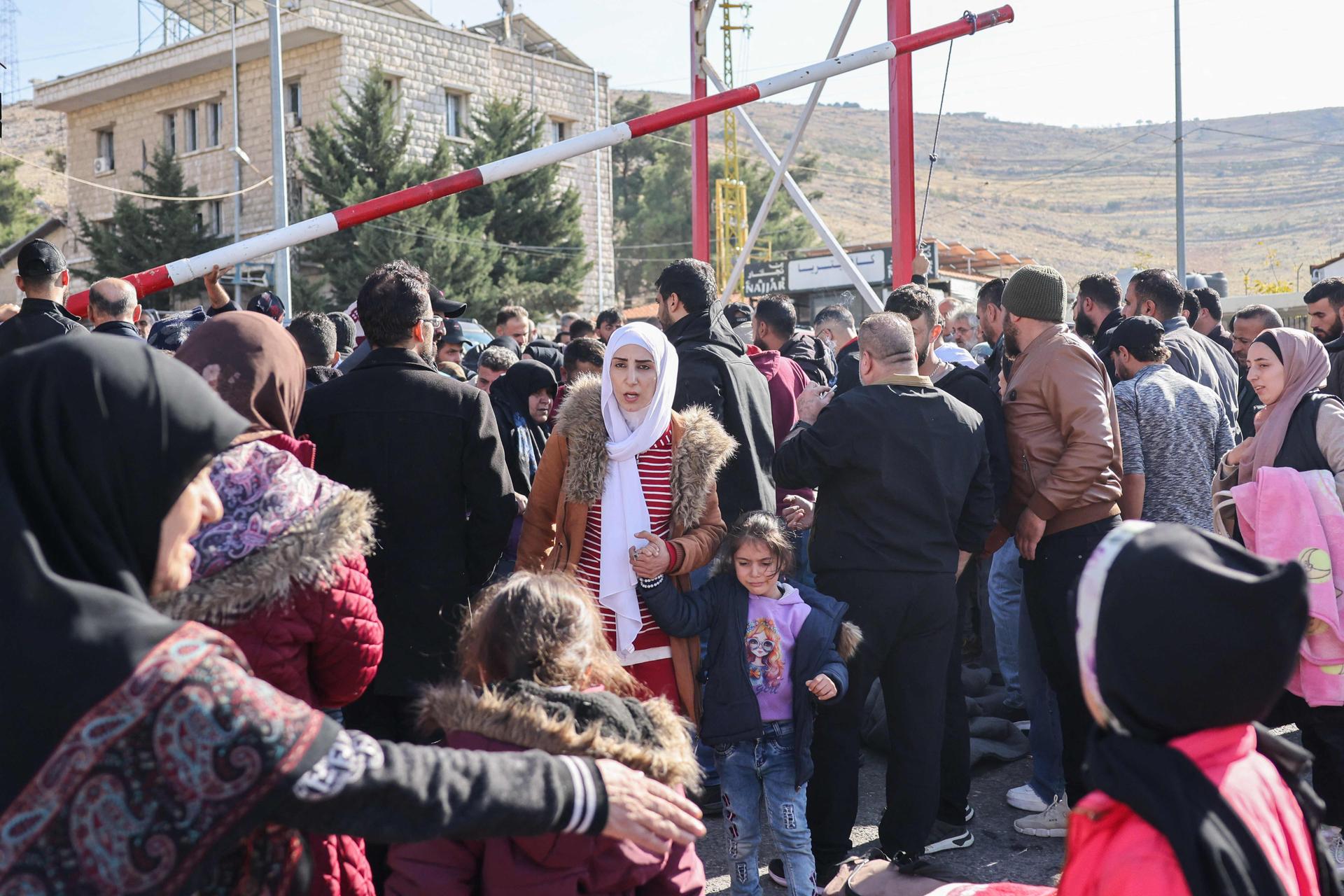 Syrian families at the Masnaa border crossing in Lebanon, December 9, 2024.
