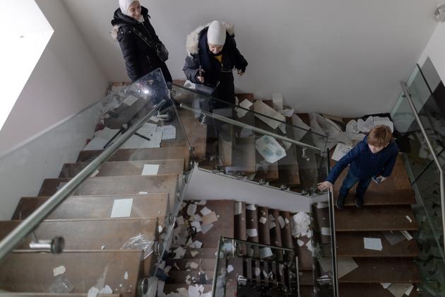 Neighbors visit the Assad family villa in Damascus on December 11, 2024.