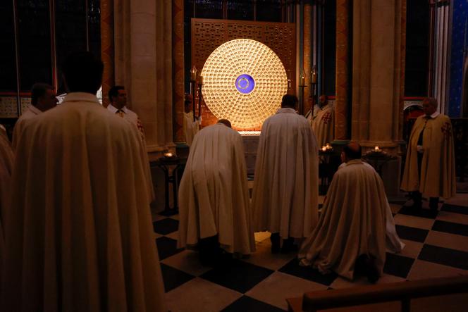 Knights of the Equestrian Order of the Holy Sepulchre pray in front of the Holy Crown of Thorns in Notre-Dame de Paris, Paris, France, December 13, 2024.