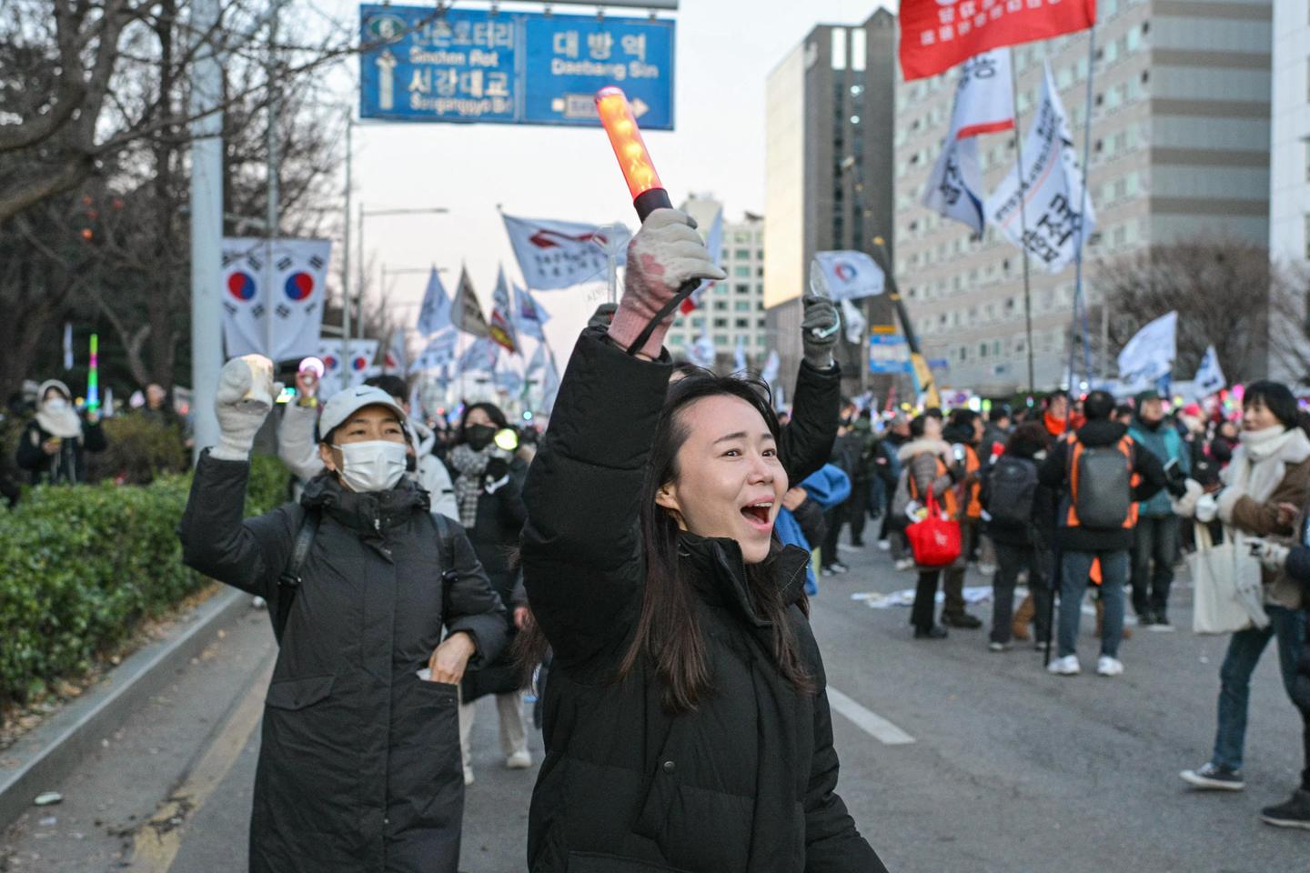 In South Korea, young women spearhead protests against the president