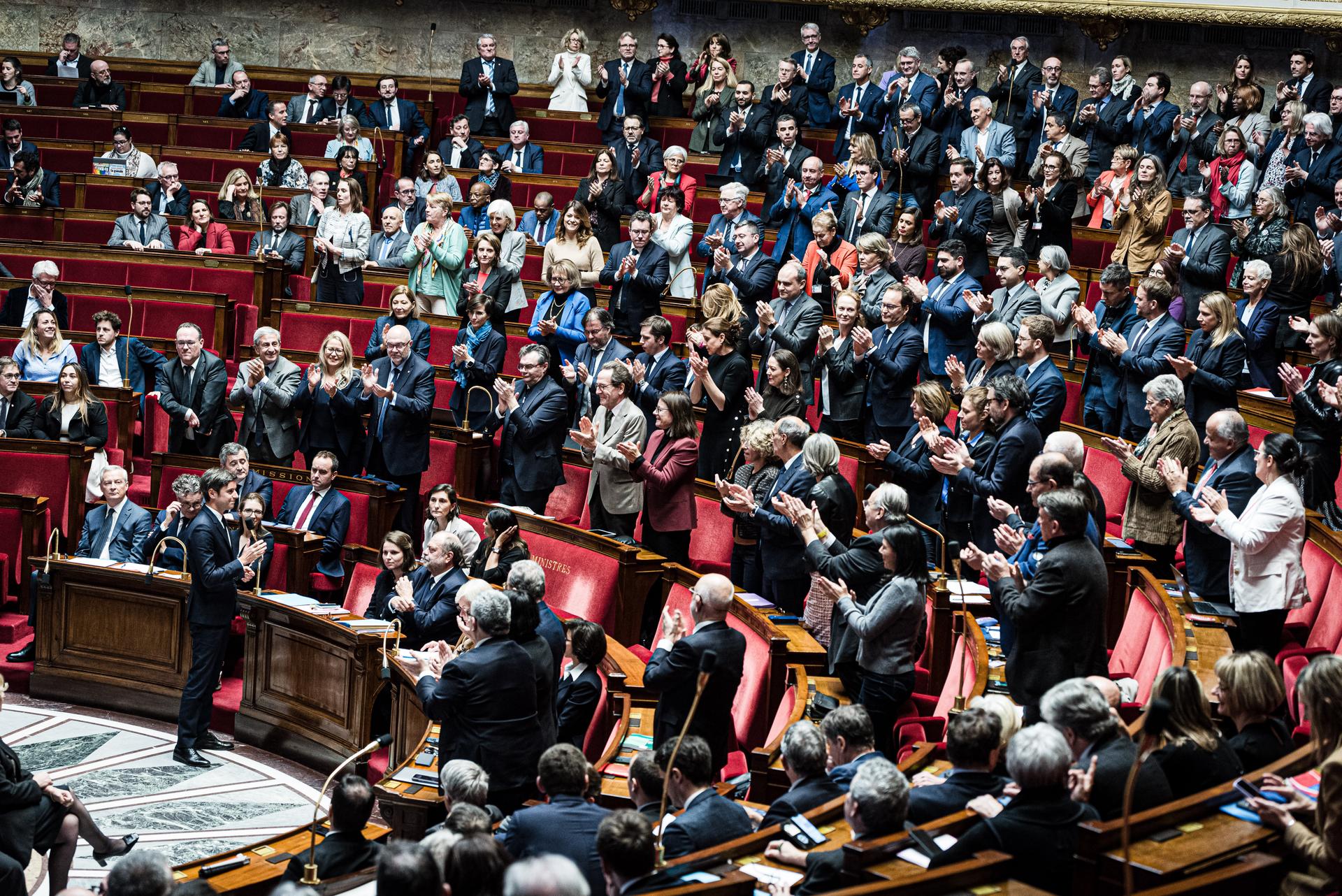 Gabriel Attal, appointed prime minister on January 9, is applauded by MPs from his coalition, during a government question session at the Assemblée Nationale. Paris, January 16, 2024.