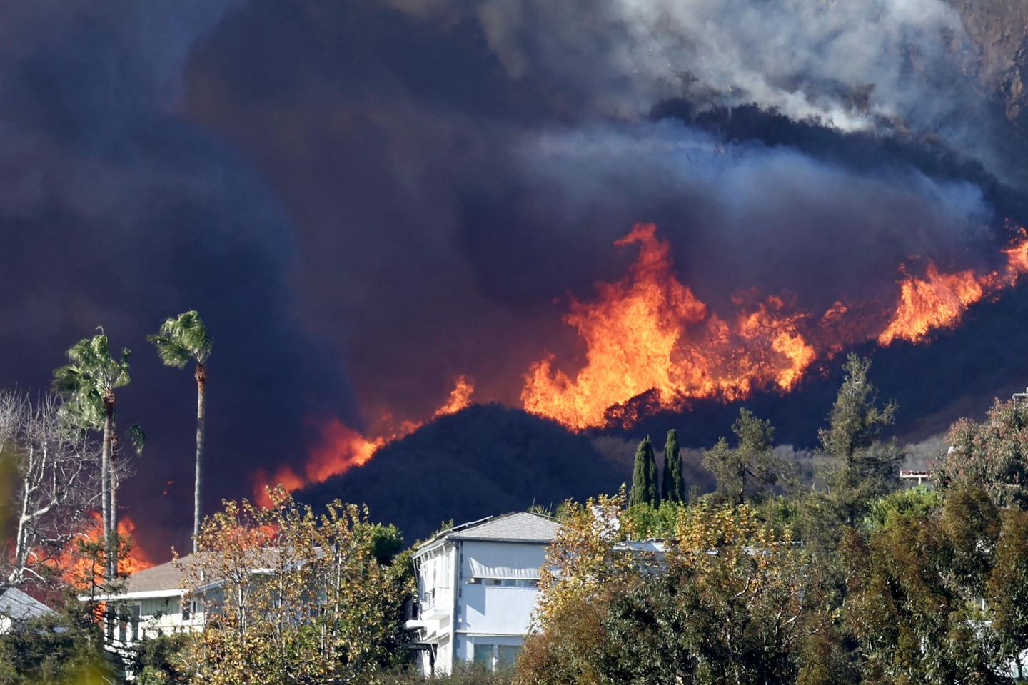 Los Angeles residents flee fire as potentially 'life-threatening, destructive' winds gain strength