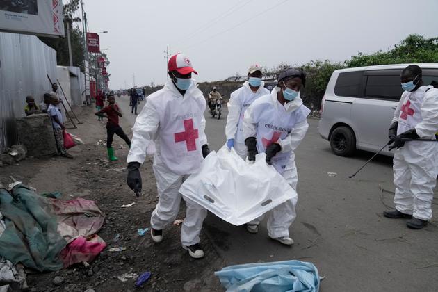 Members of the Congolese Red Cross pick up the bodies, presumed to have been soldiers of the Armed Forces of the Democratic Republic of the Congo (FARDC), killed fighting the M23 rebels, in Goma, on January 30, 2025.