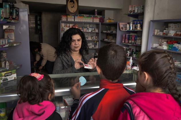 Eva Lati, a Christian pharmacist, in her pharmacy in the Al-Arman neighborhood of Homs, Syria, January 31, 2025.