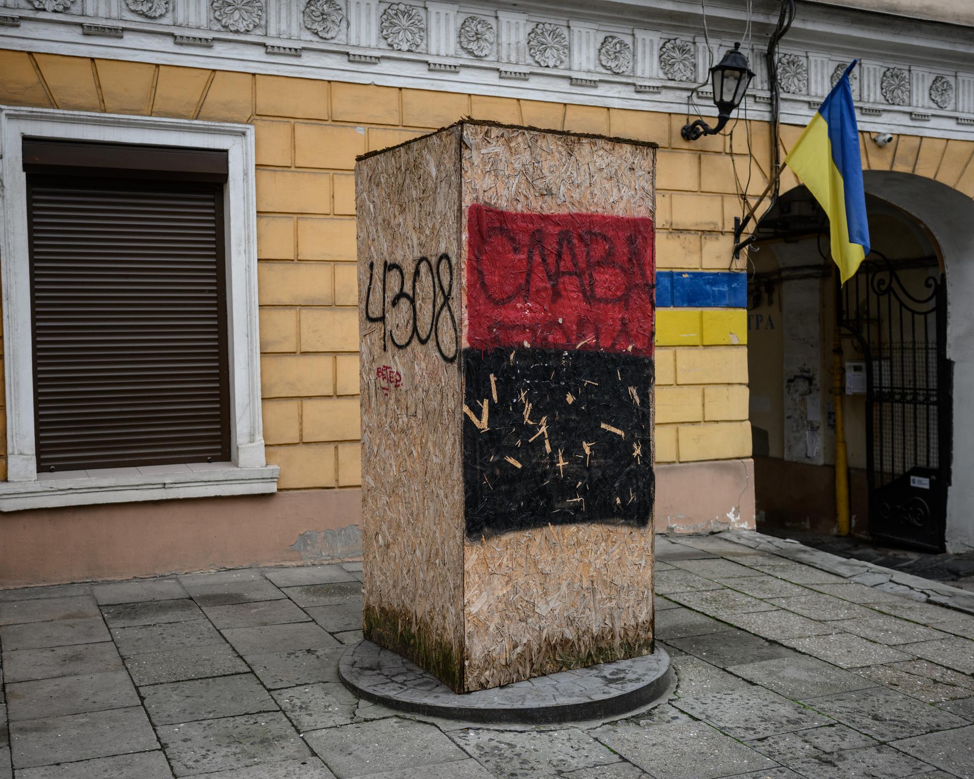 The statue of Russian poet and playwright Alexander Pushkin, located at the entrance to the museum dedicated to him in Odesa, is protected from vandalism by planks. The red and black colors belong to the Ukrainian nationalist flag, January 30, 2025.