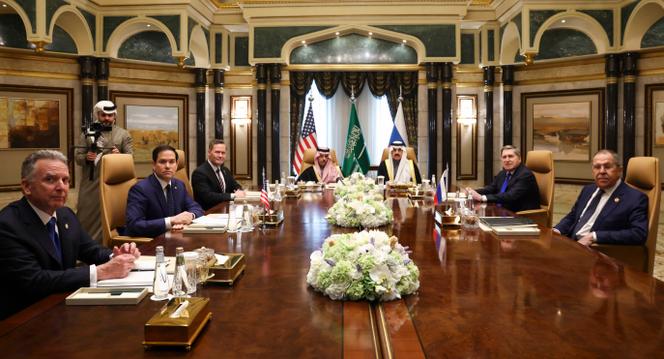 U.S. Secretary of State Marco Rubio, second left, meets with Saudi Foreign Minister Prince Faisal bin Farhan Al Saud, Saudi National Security Advisor Mosaad bin Mohammad Al-Aiban, U.S. National Security Advisor Mike Waltz, third left, U.S. Middle East envoy Steve Witkoff, left, Russian Foreign Minister Sergei Lavrov, right, and Russian President Vladimir Putin's foreign policy advisor Yuri Ushakov, second right, at Diriyah Palace, in Riyadh, Saudi Arabia, Tuesday Feb. 18, 2025. (Evelyn Hockstein/Pool Photo via AP)