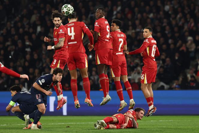 Liverpool's defensive wall attempt to block a PSG free kick during the UEFA Champions League Round of 16 first leg football match between Paris Saint-Germain (FRA) and Liverpool (ENG) at the Parc des Princes stadium in Paris on March 5, 2025.
