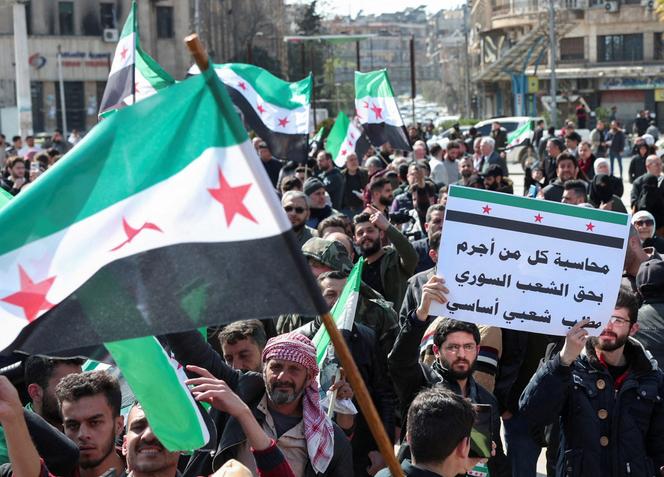 Syrians demonstrate in support of the Syrian government, after attacks carried out by groups loyal to ousted leader Bashar al-Assad in the Latakia region, in Aleppo, Syria, March 7, 2025. 
