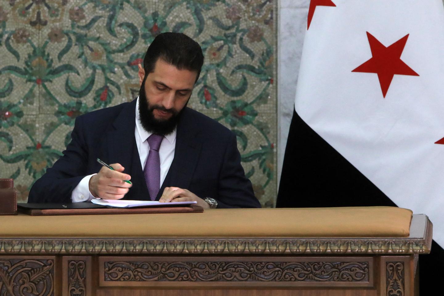 Syria leader signs constitutional declaration, hails start of 'new history'