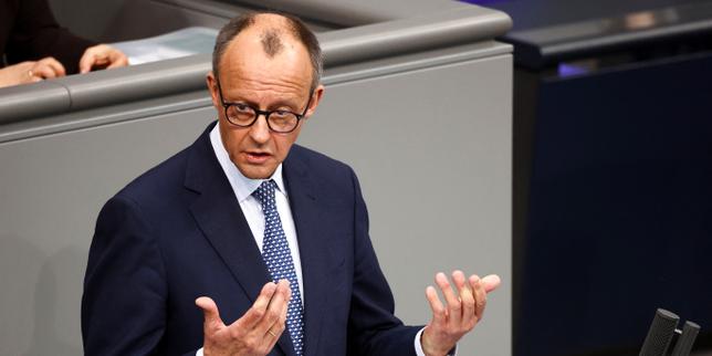 Germany's Merz urges MPs to back spending bonanza in fiery debate